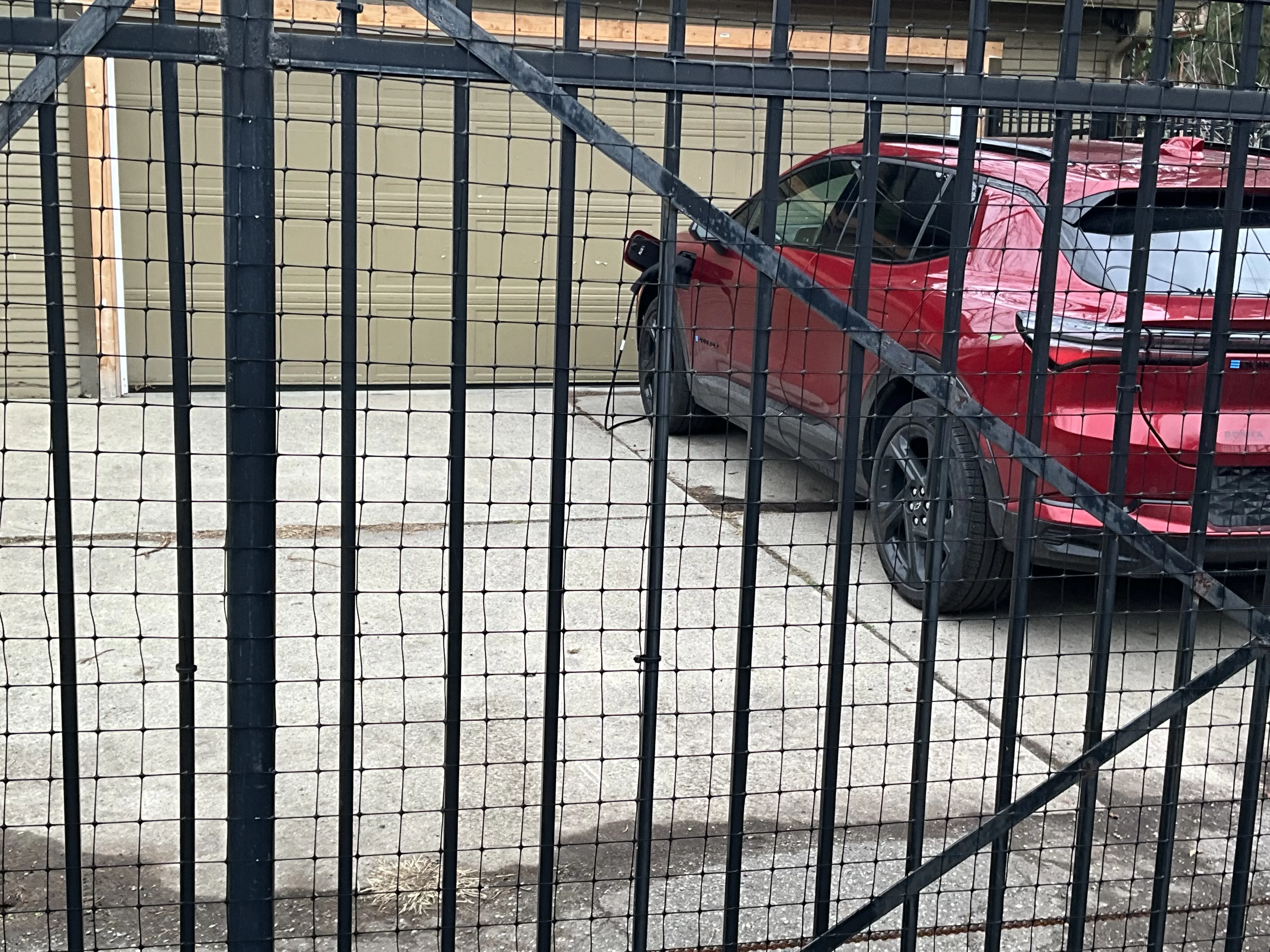 EQEV charging in the driveway.webp